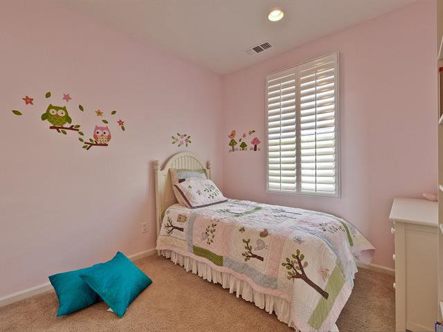 247 Peppermint Tree Terrace, Unit 3 Sunnyvale, CA 94086 - Photo 18 of 25 a bedroom with a bed and a window