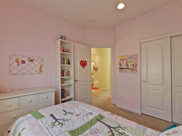 247 Peppermint Tree Terrace, Unit 3 Sunnyvale, CA 94086 - Photo 19 of 25 a bedroom with a bed and a cabinets