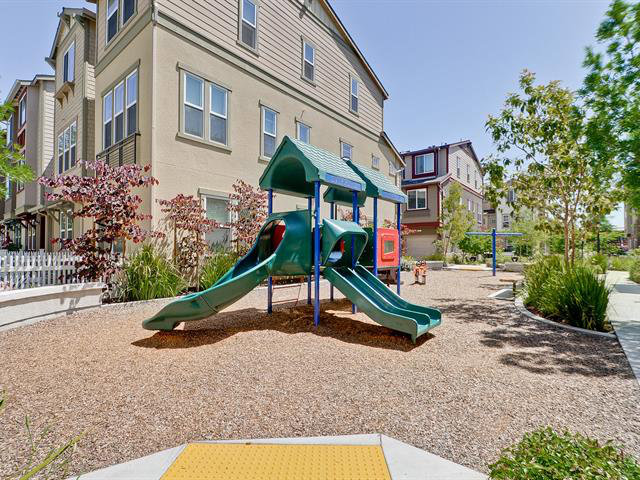 247 Peppermint Tree Terrace, Unit 3 Sunnyvale, CA 94086 - Photo 25 of 25 front view of a building with a park