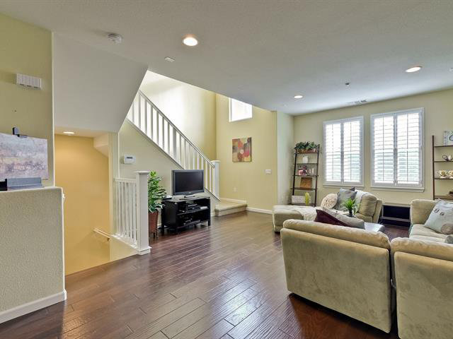 247 Peppermint Tree Terrace, Unit 3 Sunnyvale, CA 94086 - Photo 4 of 25 a living room with furniture and a flat screen tv