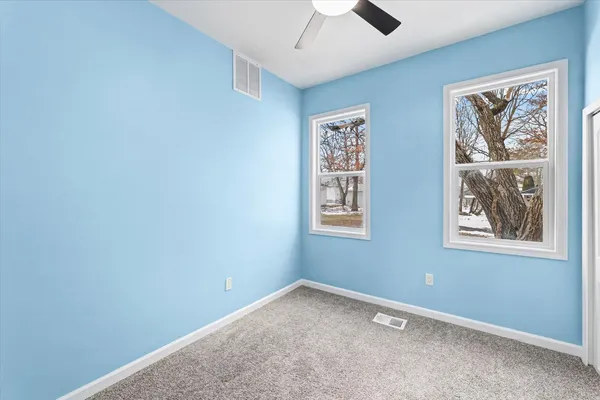 an empty room with windows