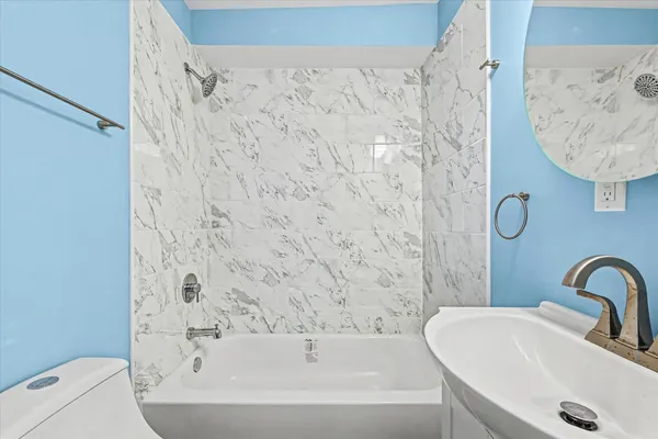 a bathroom with a sink and a bathtub