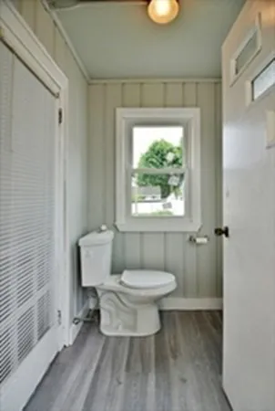 a bathroom with a toilet sink and a shower