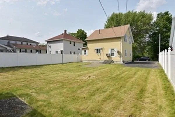 a house view with swimming pool in front of it