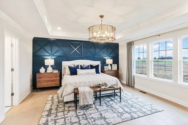 a bedroom with a bed and a table