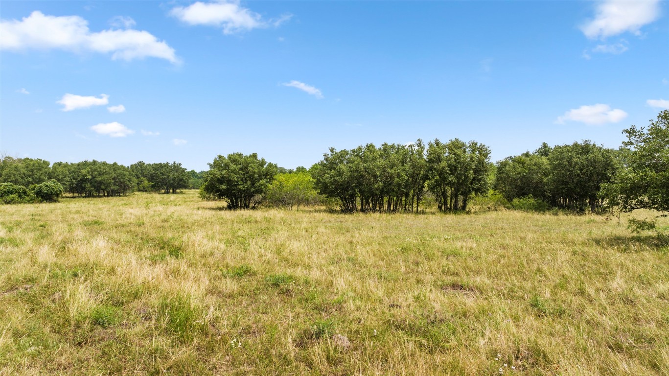 3575 Westwood Road Lockhart, TX 78644 - Photo 20 of 32 a view of a yard with an outdoor space and seating