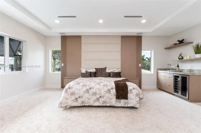 a bathroom with a double vanity sink mirror and shower