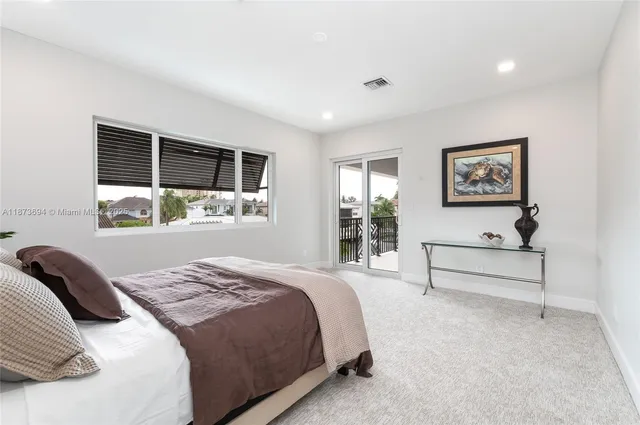 a view of swimming pool with palm trees