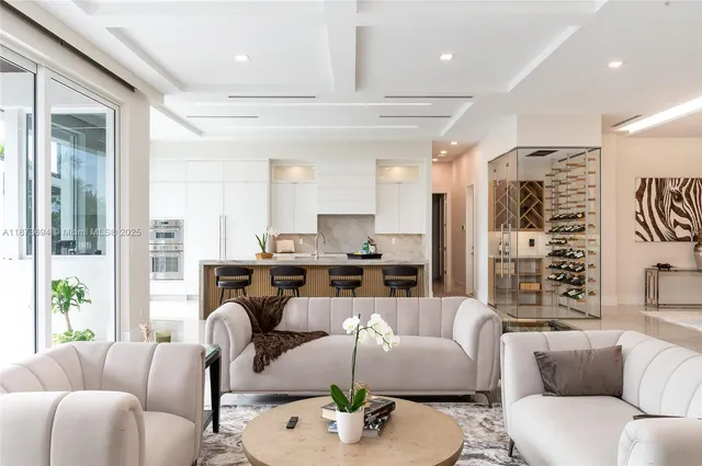 a kitchen with a table chairs refrigerator and cabinets