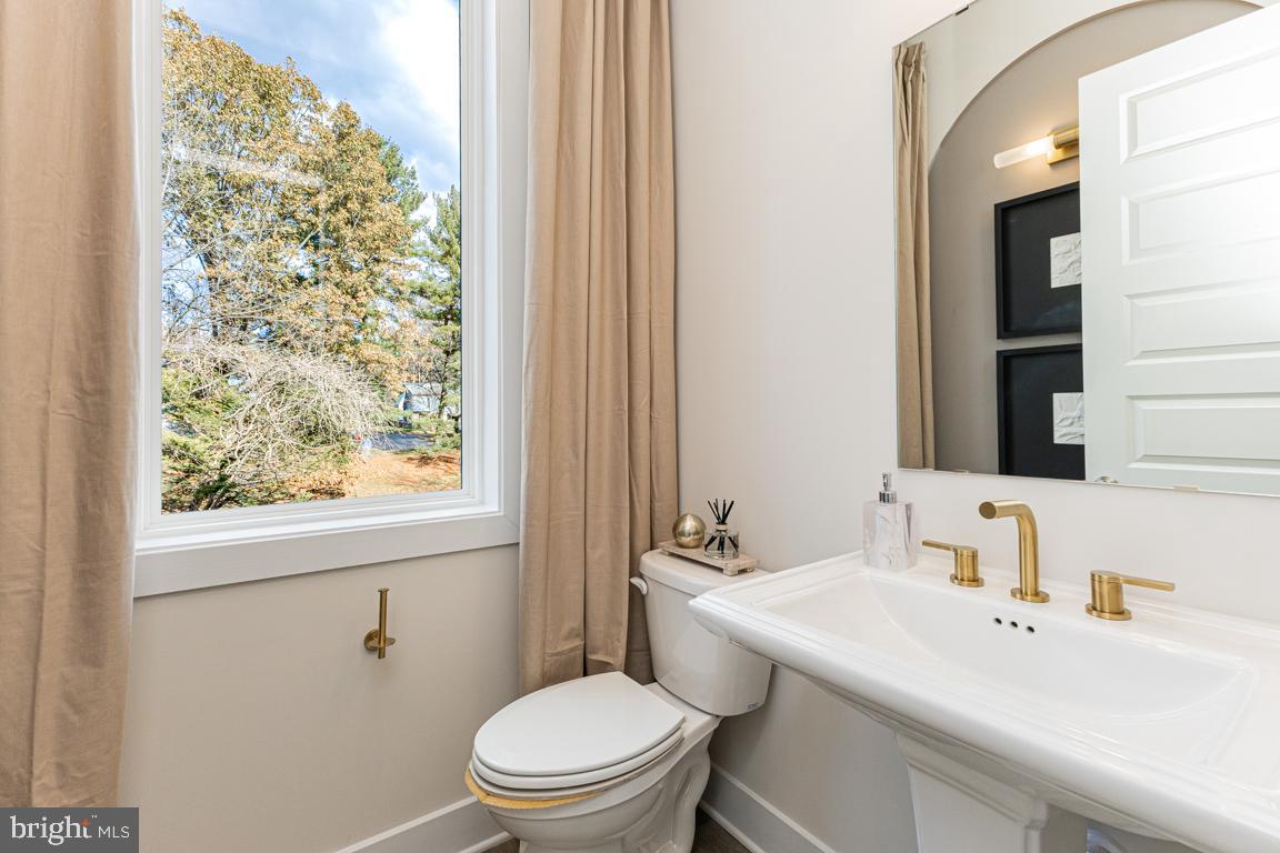 11652 American Dream Way Reston, VA 20190 - Photo 13 of 51 a bathroom with a sink a toilet and a window