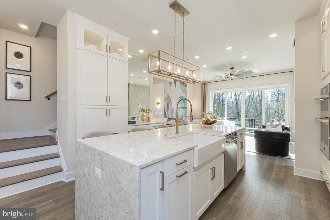 11652 American Dream Way Reston, VA 20190 - Photo 18 of 51 a large white kitchen with a large window