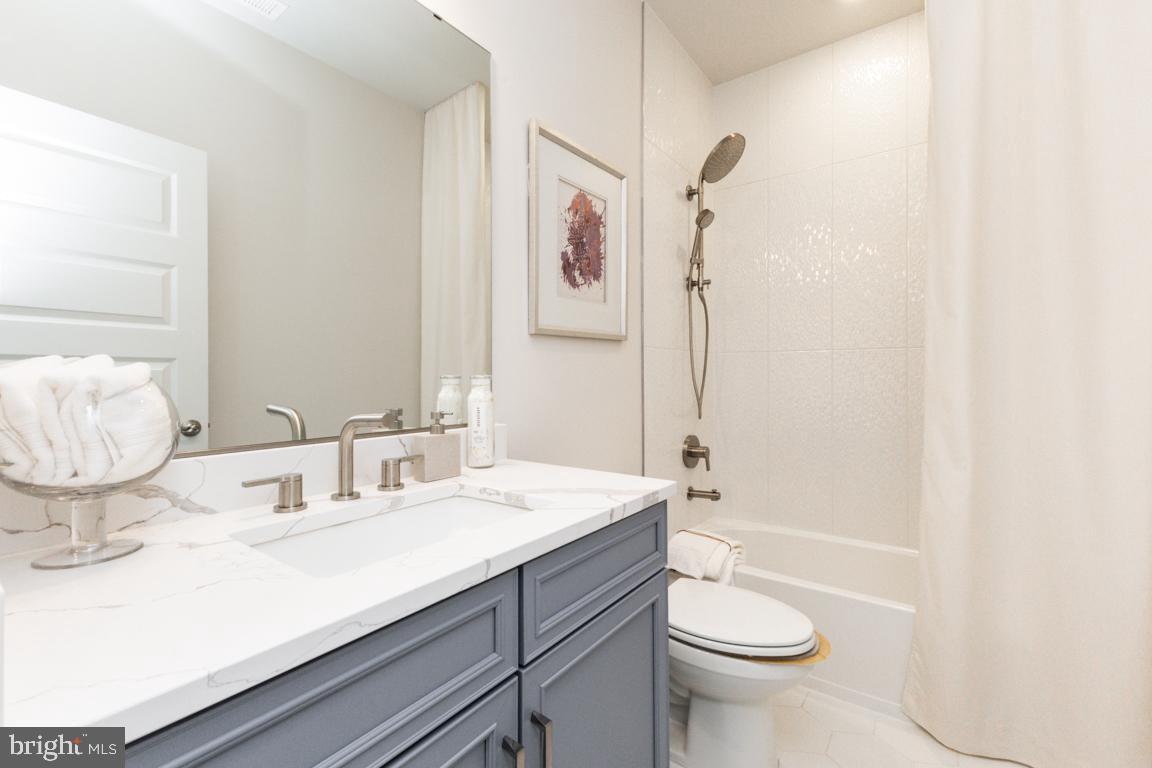 11652 American Dream Way Reston, VA 20190 - Photo 25 of 51 a bathroom with a sink a toilet and shower