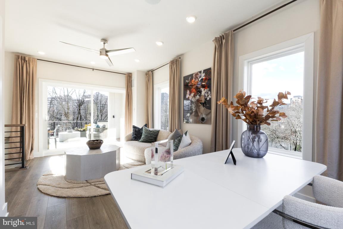 11652 American Dream Way Reston, VA 20190 - Photo 30 of 51 a view of a dining room with furniture large windows and wooden floor