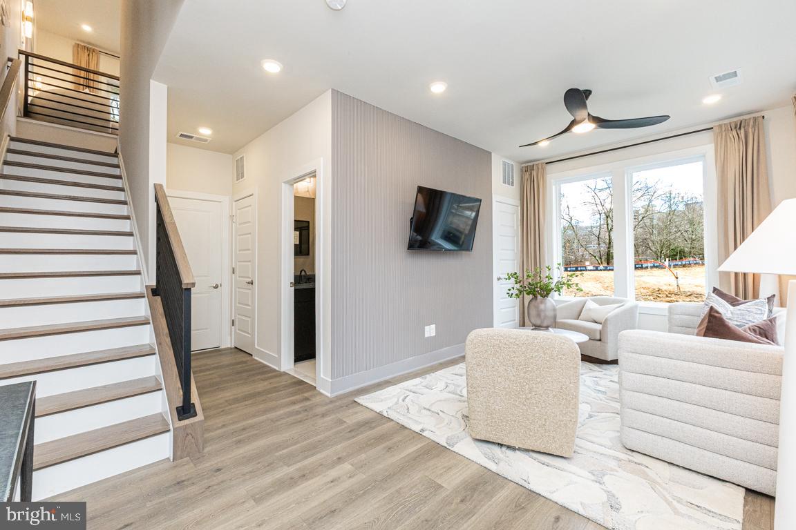 11652 American Dream Way Reston, VA 20190 - Photo 7 of 51 a living room with furniture and a large window