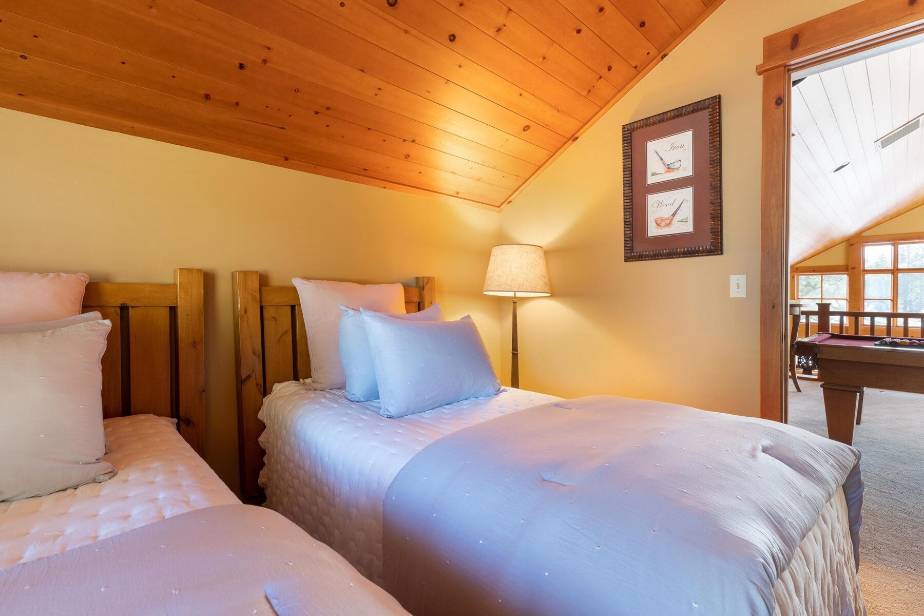 12202 Lookout Loop, Unit F2030 Truckee, CA 96161 - Photo 18 of 28 a bedroom with a bed and wooden floor