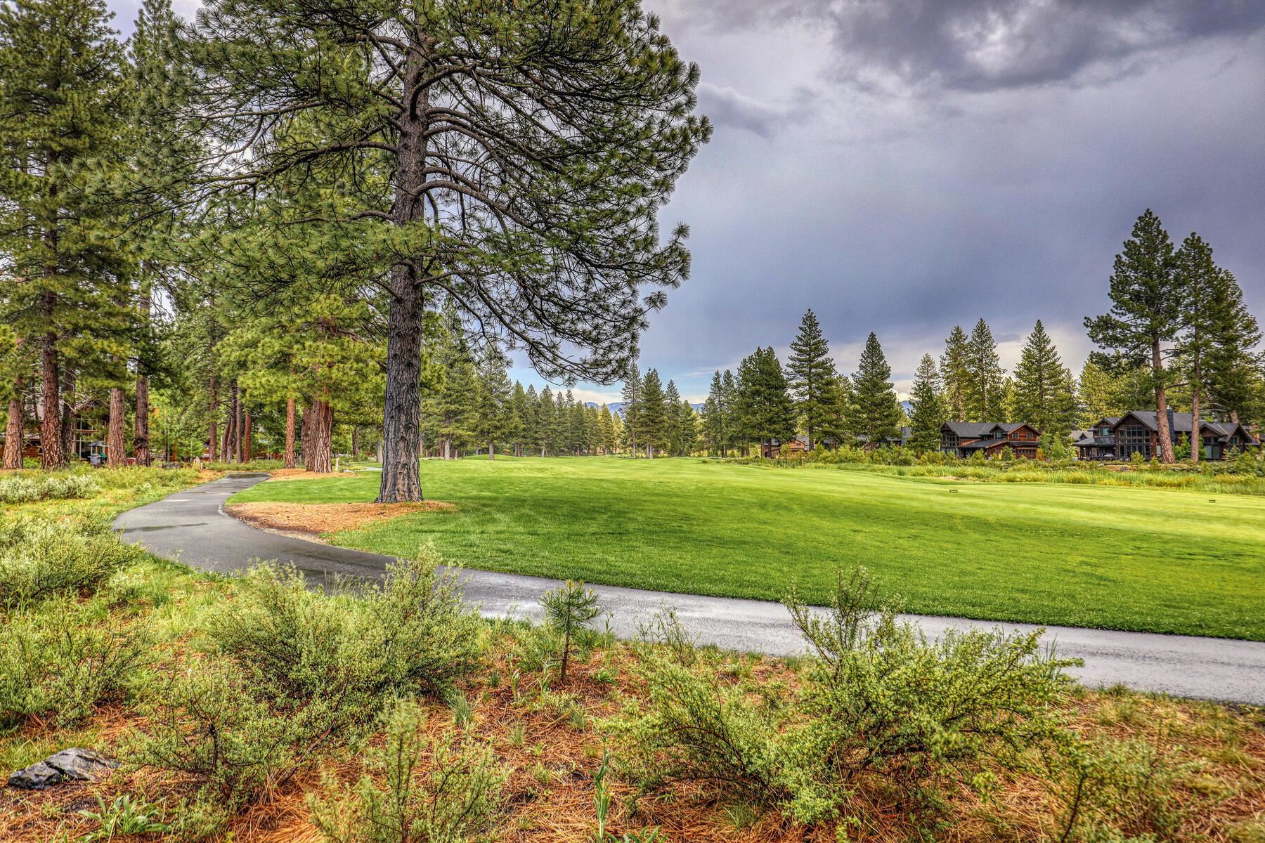 12202 Lookout Loop, Unit F2030 Truckee, CA 96161 - Photo 22 of 28 a view of a fountain in front of a house with a big yard and large trees