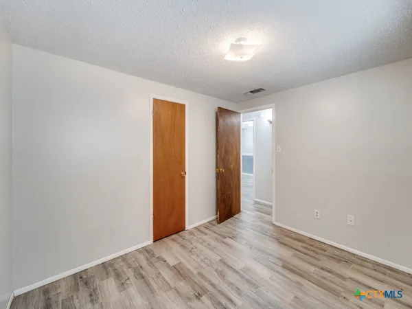 a view of hallway with natural light