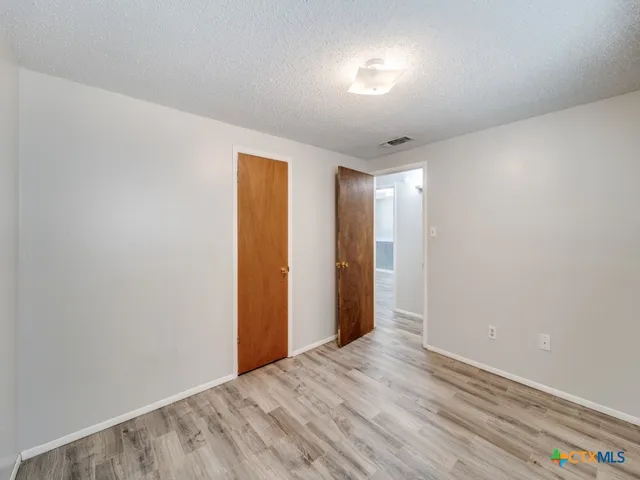 a view of hallway with natural light