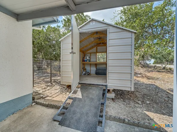 a view of house with backyard