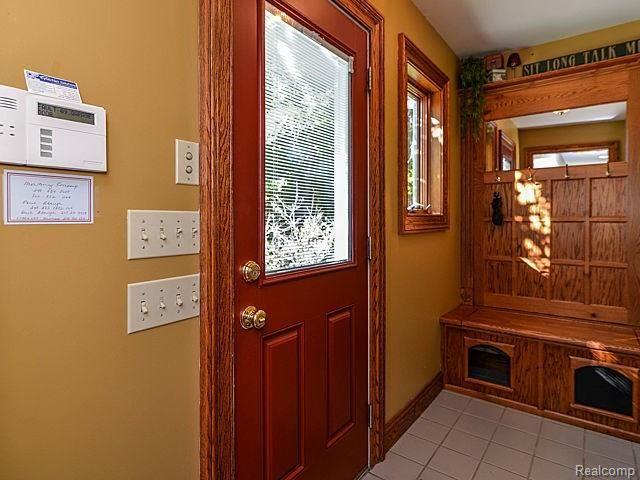 3010 County Farm Road Howell, MI 48843 - Photo 17 of 50 Mudroom with storage bench
