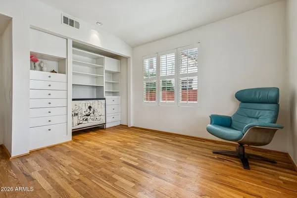 a bedroom with furniture and a window