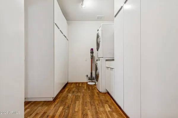 a view of a room with wooden floor and staircase