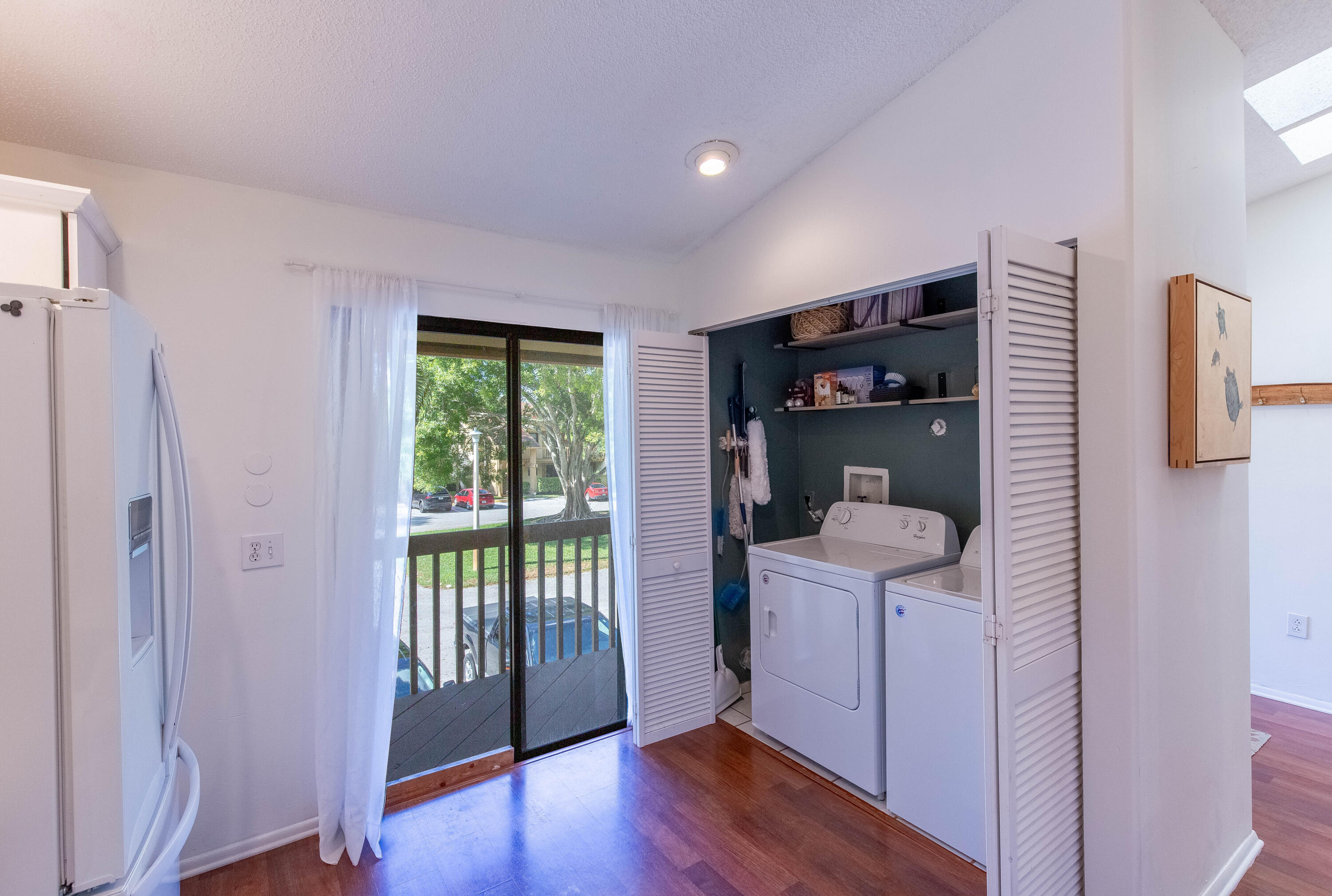 13165 Chadwick Court, Unit 32 Wellington, FL 33414 - Photo 11 of 25 a view of a hallway with wooden floor and entryway