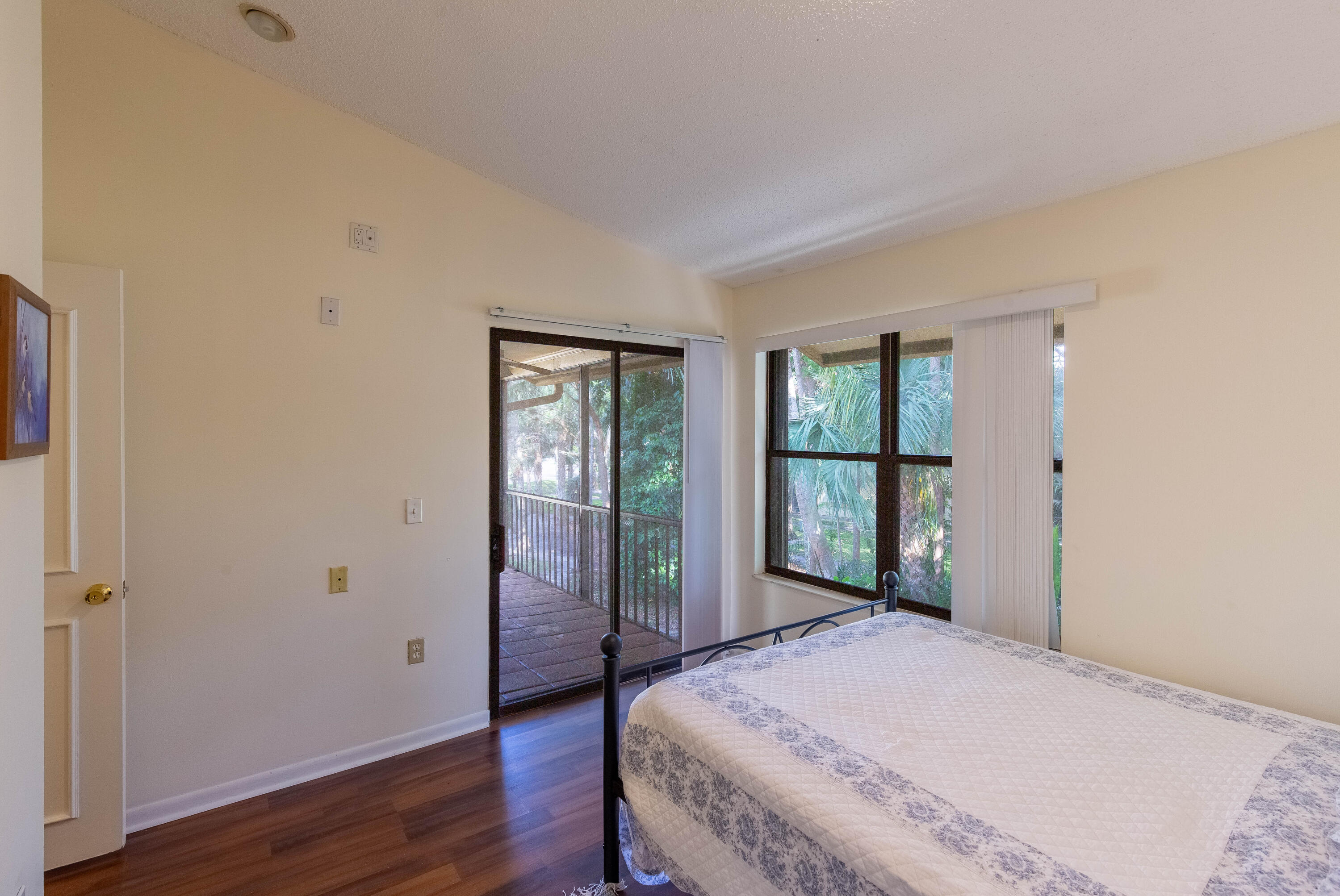 13165 Chadwick Court, Unit 32 Wellington, FL 33414 - Photo 17 of 25 a bedroom with a bed and a window