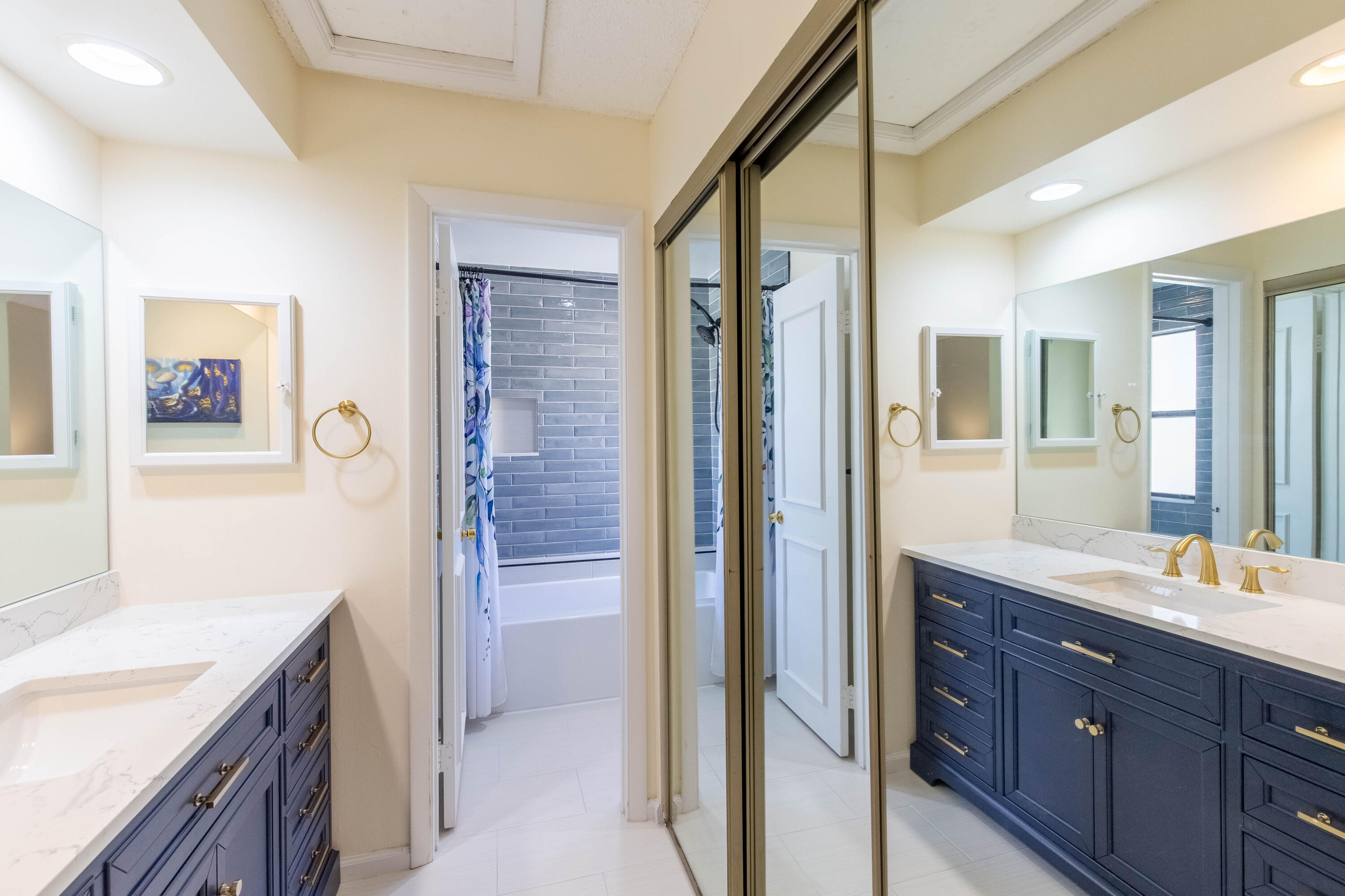 13165 Chadwick Court, Unit 32 Wellington, FL 33414 - Photo 21 of 25 a bathroom with a granite countertop sink mirror and