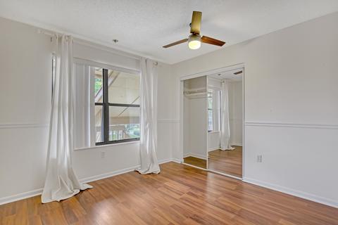 13165 Chadwick Court, Unit 32 Wellington, FL 33414 - Photo 25 of 25 an empty room with wooden floor and window