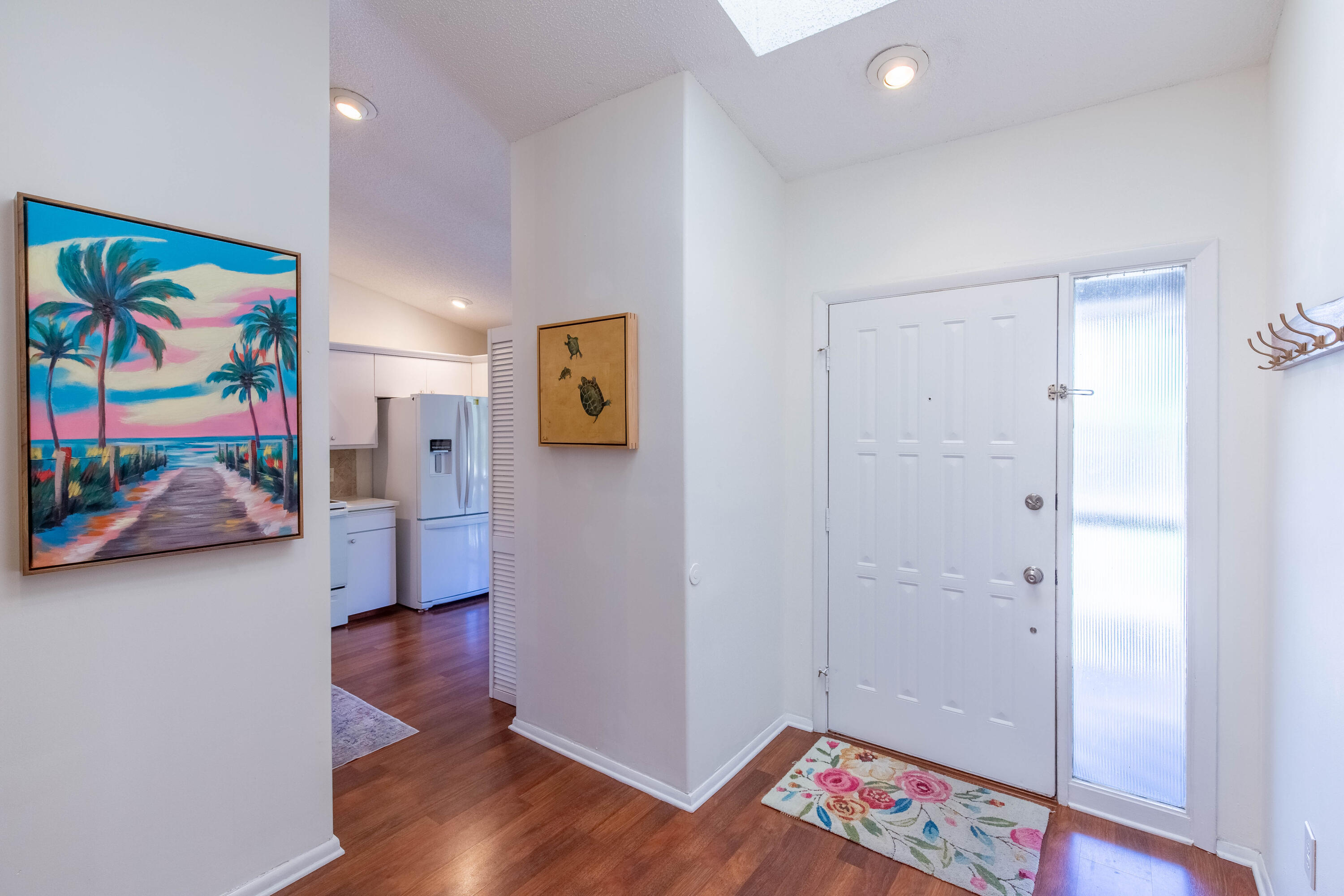 13165 Chadwick Court, Unit 32 Wellington, FL 33414 - Photo 8 of 25 a view of an entryway with wooden floor