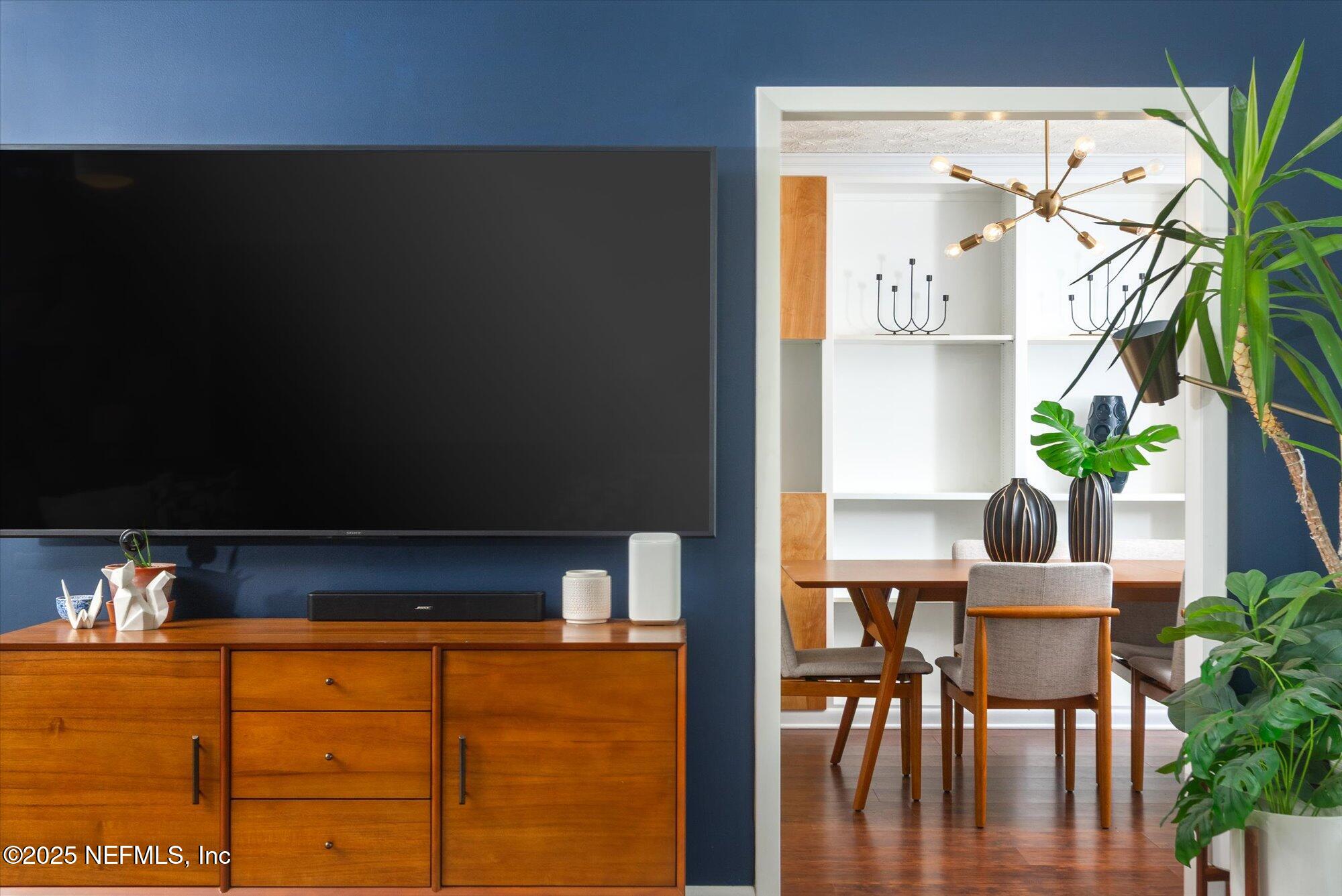 939 Grove Park Drive North Orange Park, FL 32073 - Photo 24 of 57 a living room with furniture wooden floor and a potted plant