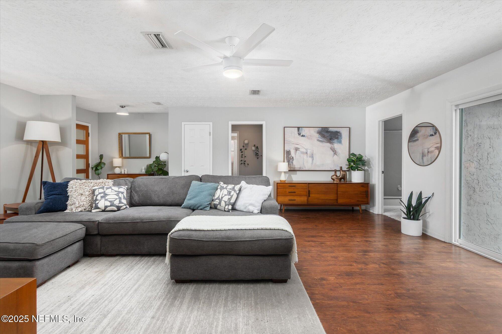 939 Grove Park Drive North Orange Park, FL 32073 - Photo 30 of 57 a living room with furniture and a wooden floor