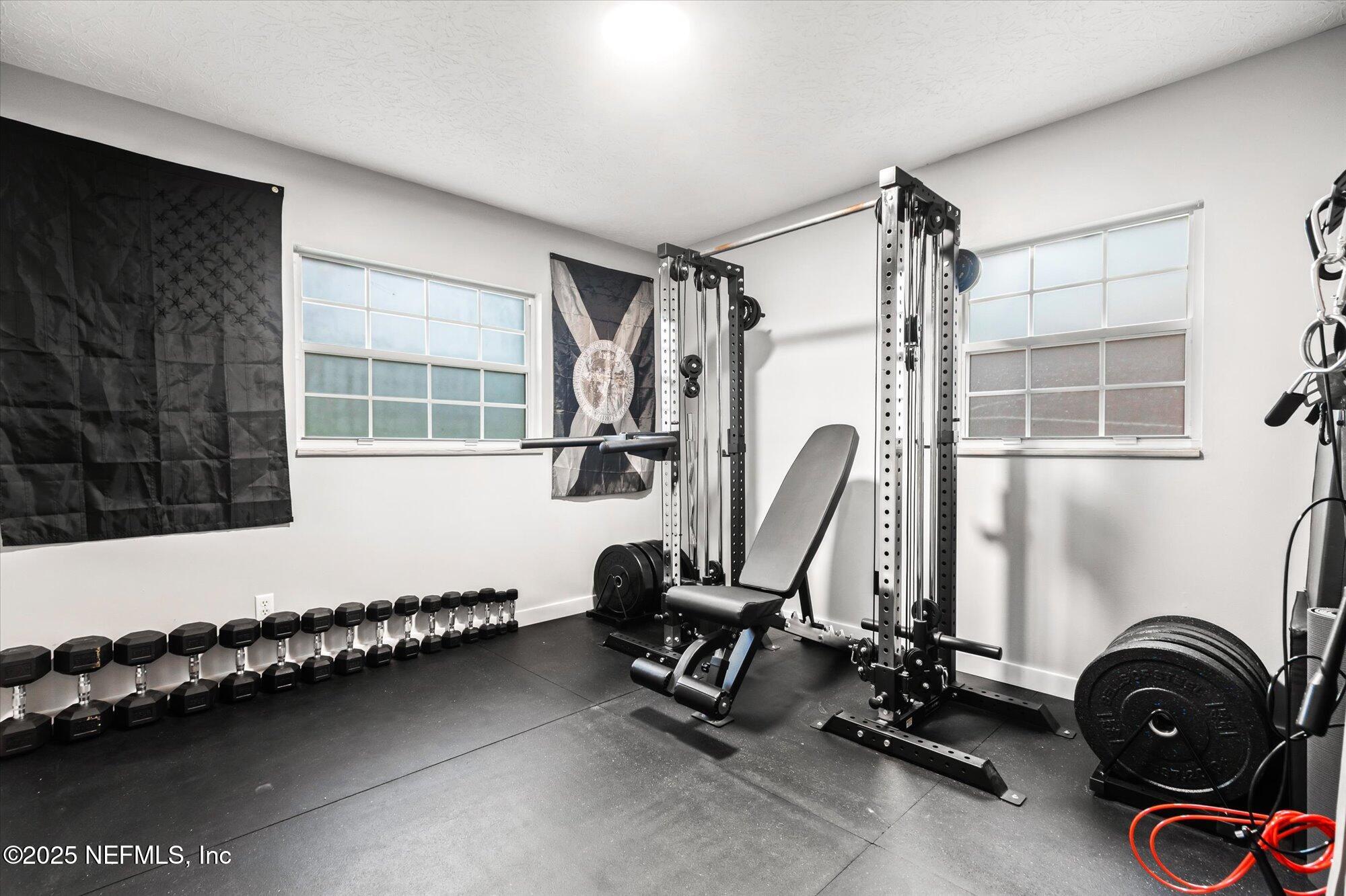 939 Grove Park Drive North Orange Park, FL 32073 - Photo 31 of 57 a view of a room with gym equipment