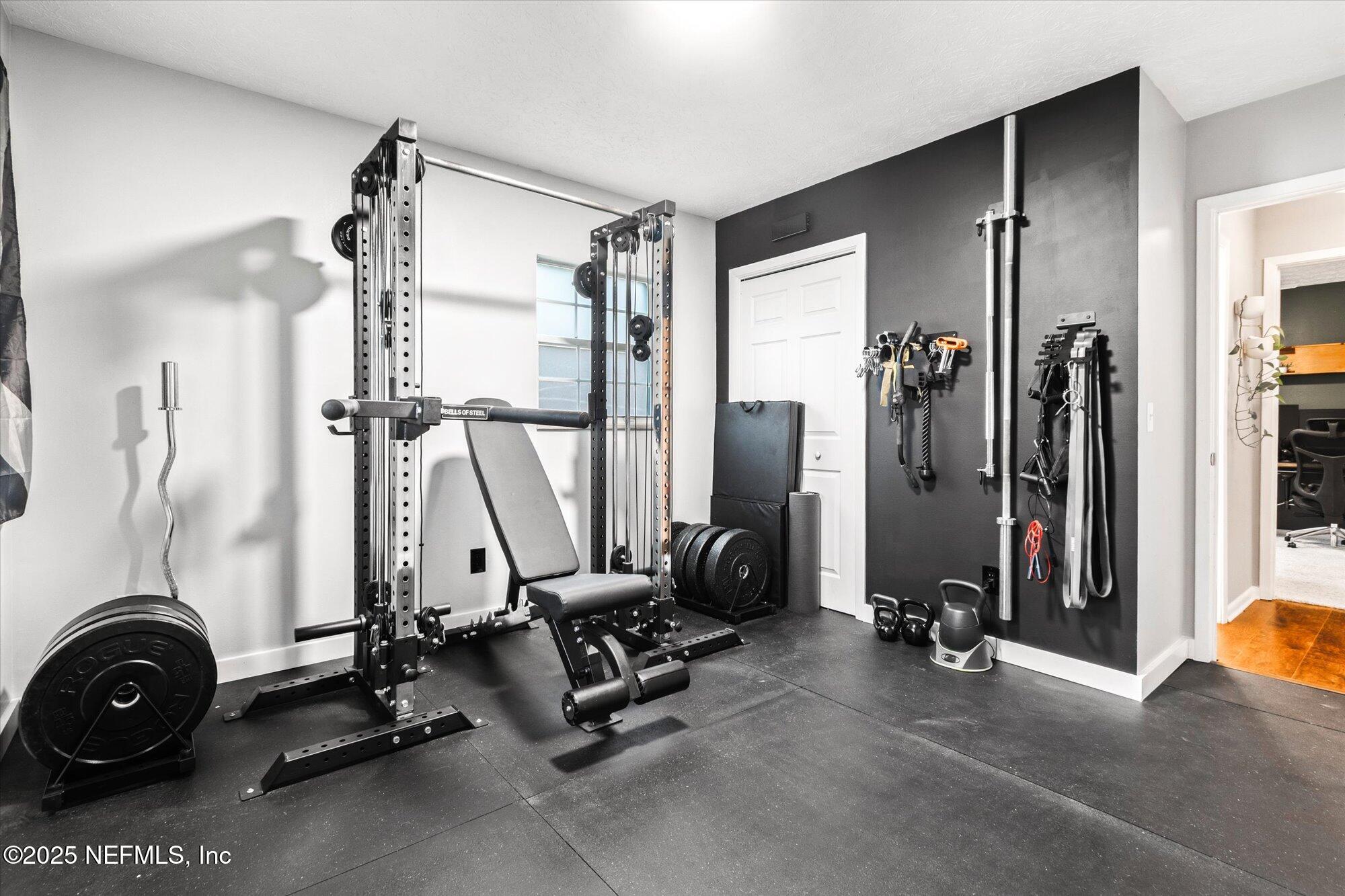 939 Grove Park Drive North Orange Park, FL 32073 - Photo 32 of 57 a view of a room with gym equipment