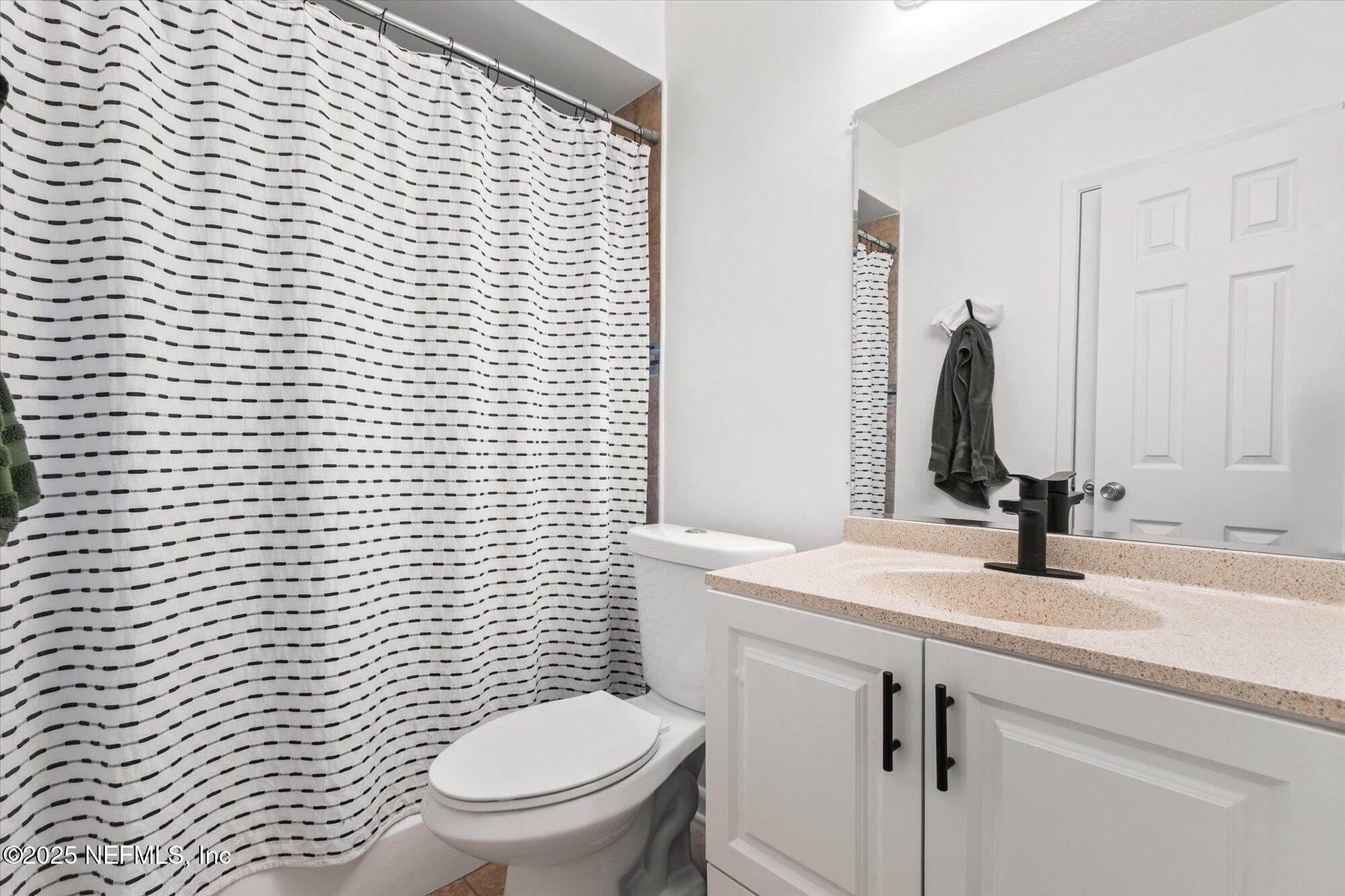 939 Grove Park Drive North Orange Park, FL 32073 - Photo 33 of 57 a bathroom with a toilet sink and mirror