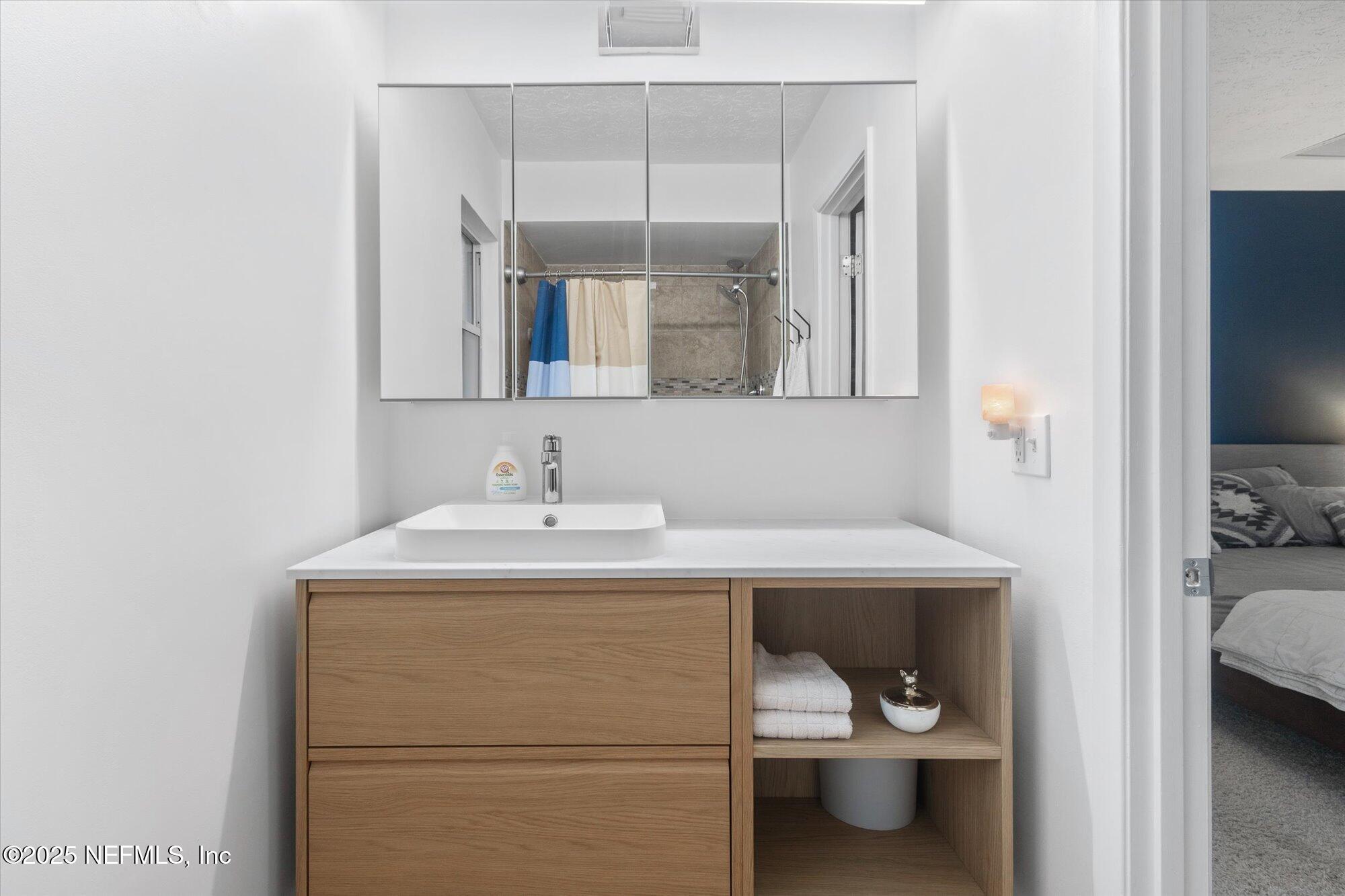 939 Grove Park Drive North Orange Park, FL 32073 - Photo 39 of 57 a bathroom with a sink toilet and shower