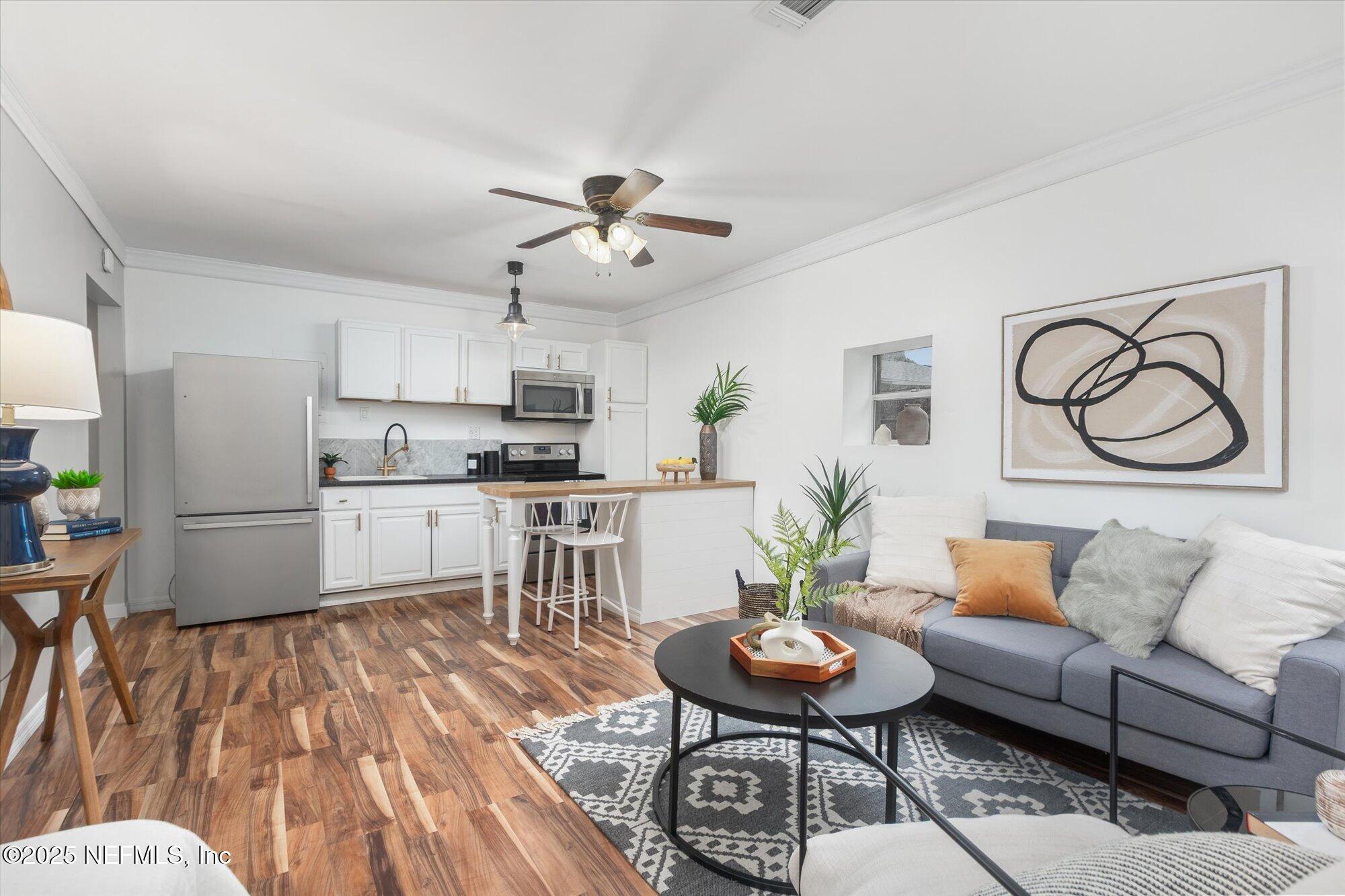 939 Grove Park Drive North Orange Park, FL 32073 - Photo 43 of 57 a living room with furniture and kitchen view