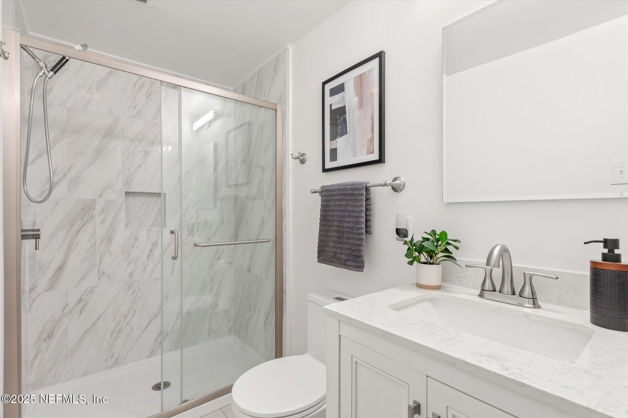 939 Grove Park Drive North Orange Park, FL 32073 - Photo 46 of 57 a bathroom with a sink toilet and shower