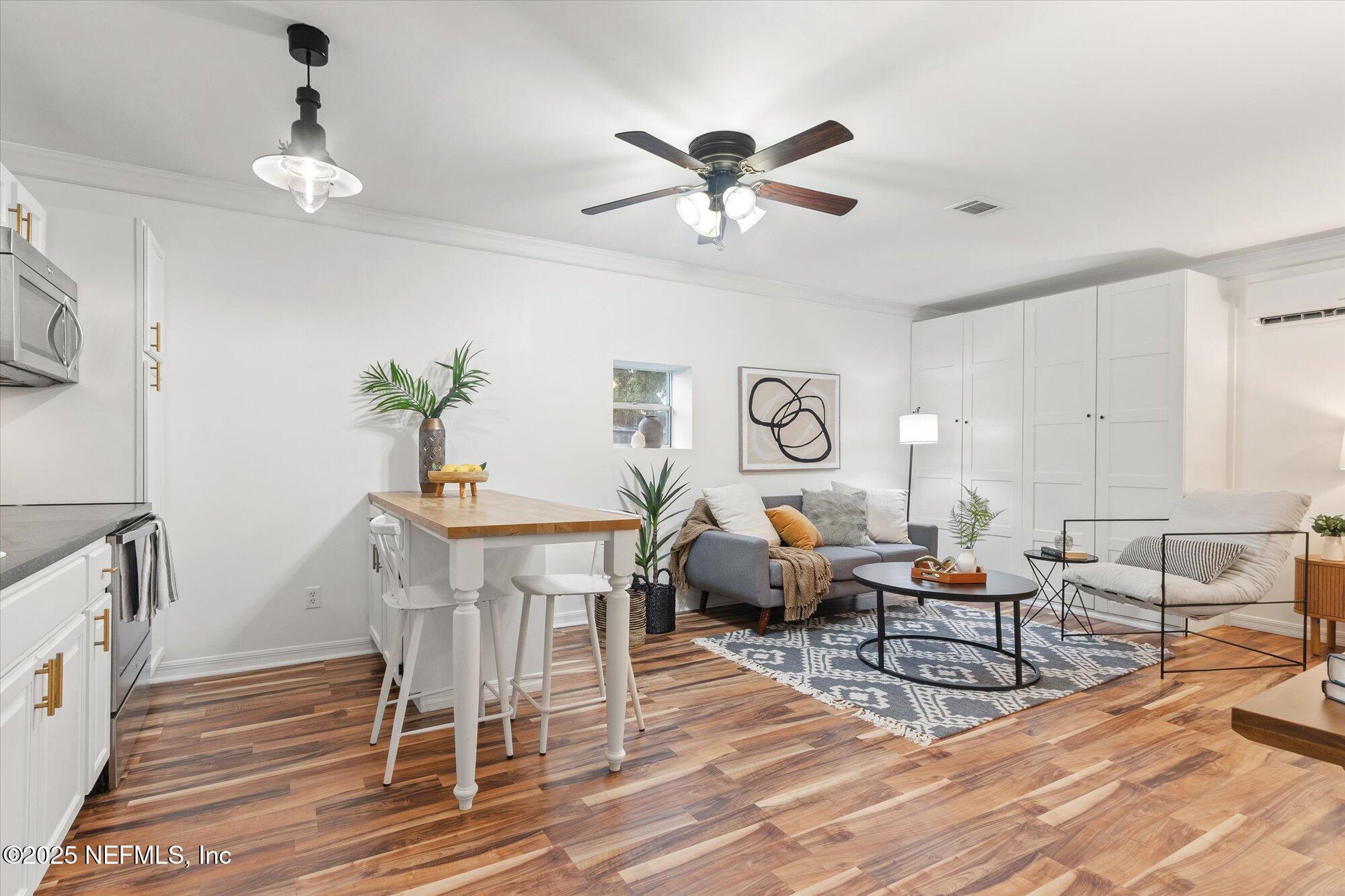939 Grove Park Drive North Orange Park, FL 32073 - Photo 47 of 57 a living room with furniture and a wooden floor