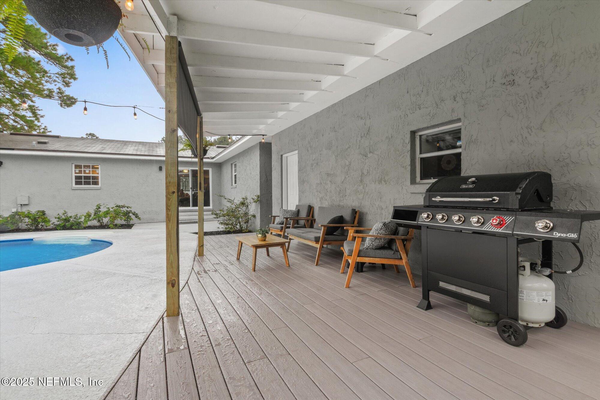 939 Grove Park Drive North Orange Park, FL 32073 - Photo 49 of 57 a view of a chairs and table in a patio