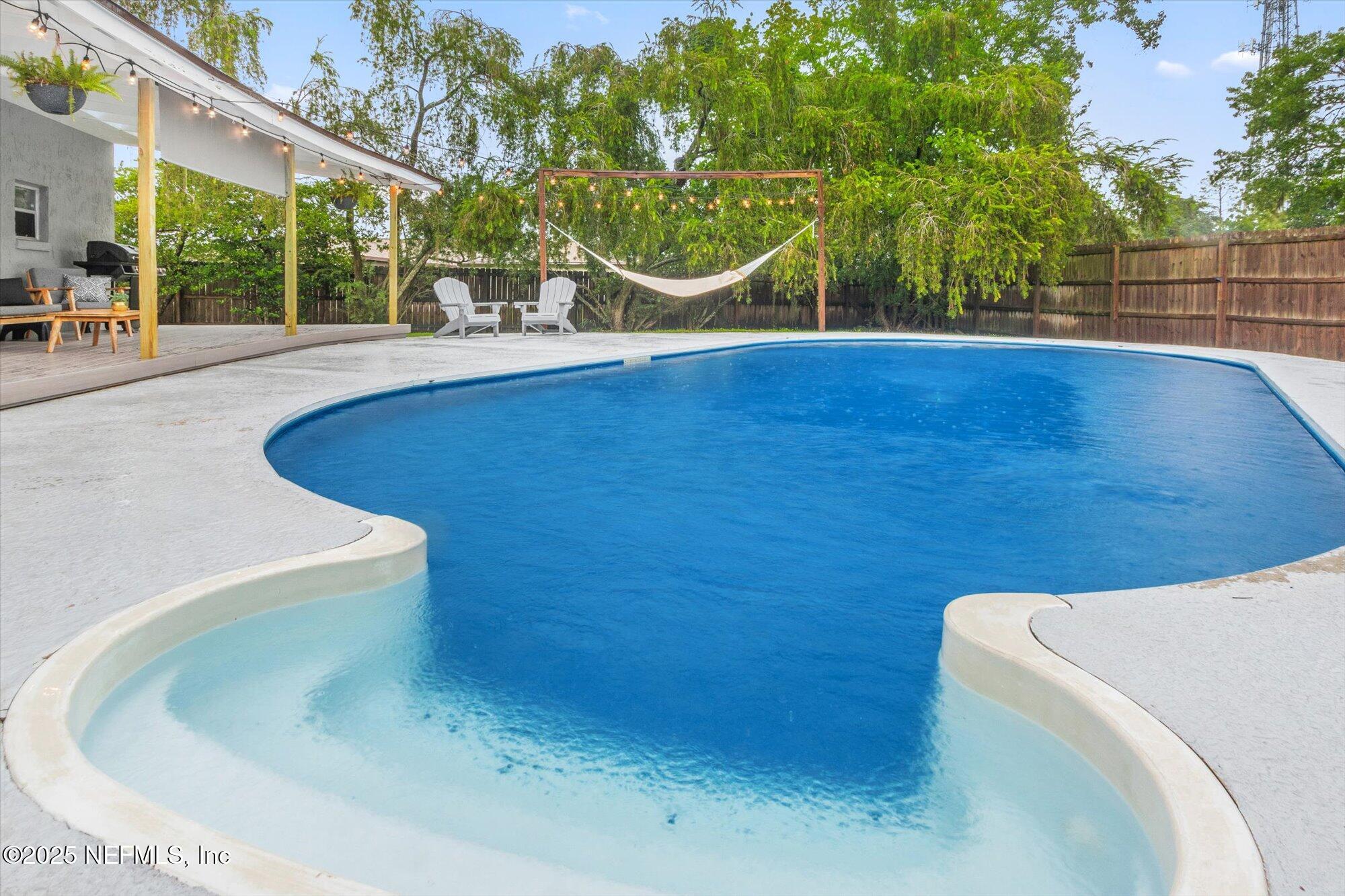 939 Grove Park Drive North Orange Park, FL 32073 - Photo 55 of 57 a view of a swimming pool with an outdoor space