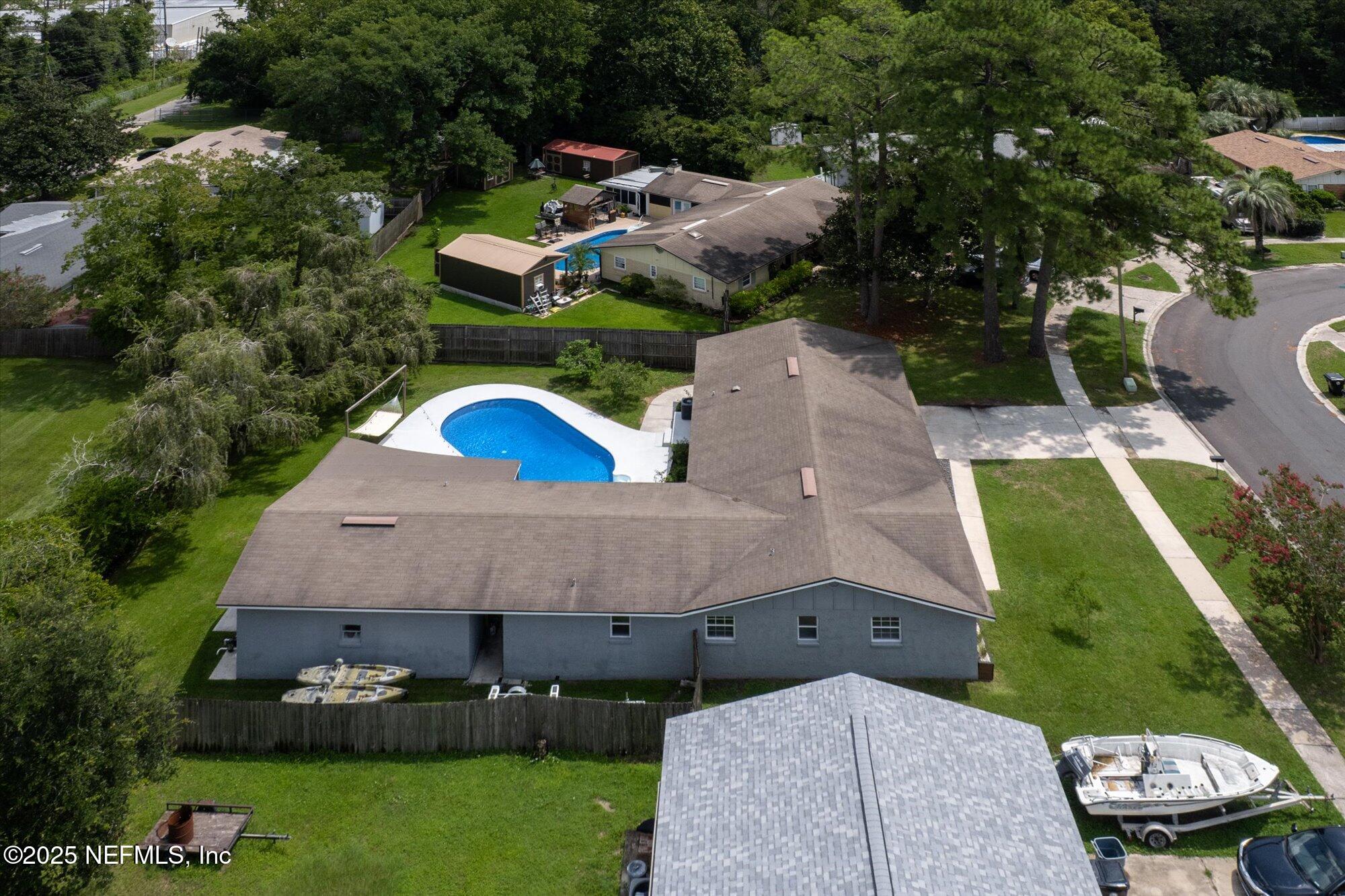 939 Grove Park Drive North Orange Park, FL 32073 - Photo 7 of 57 an aerial view of a house with a garden and lake view