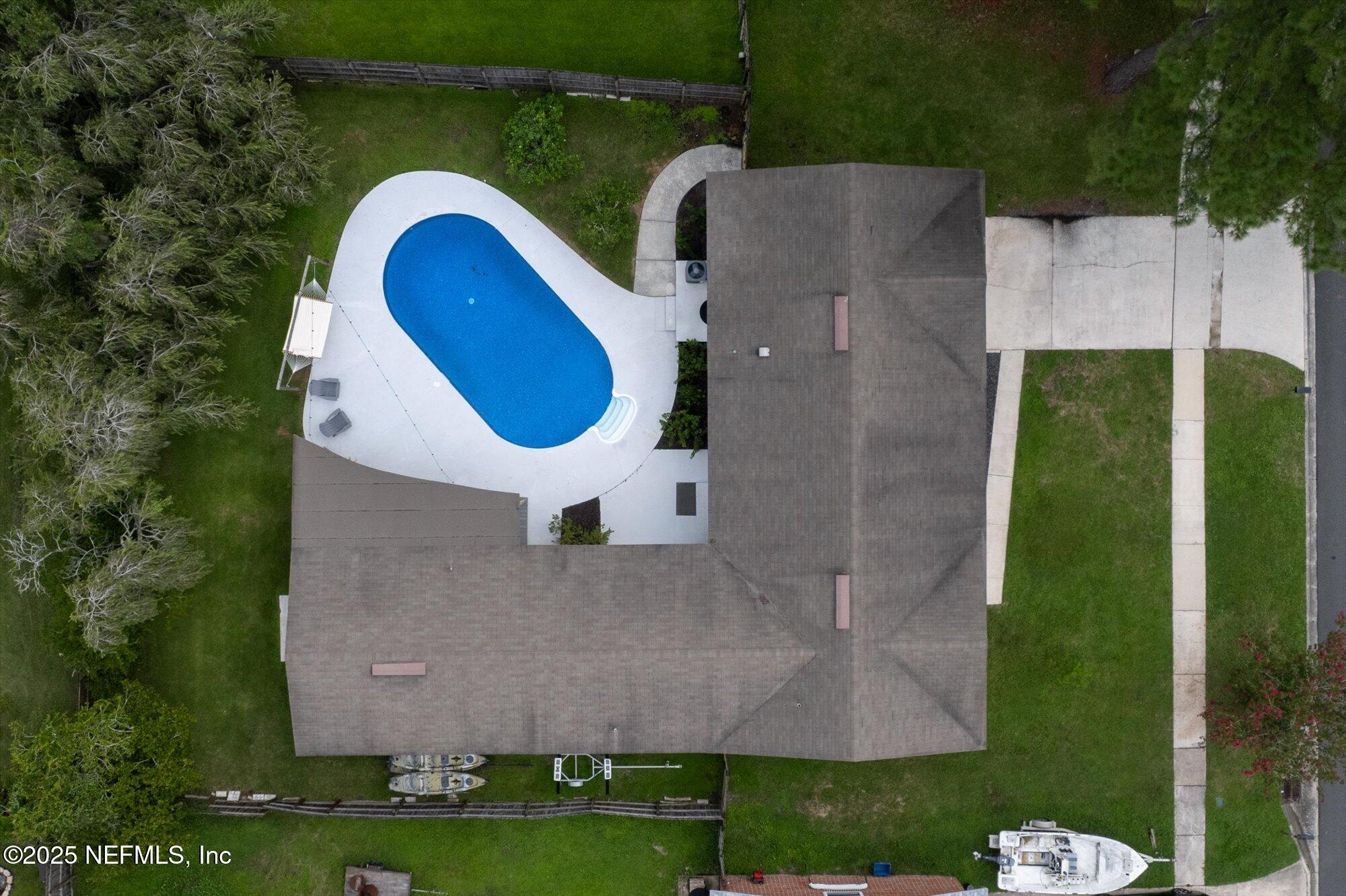 939 Grove Park Drive North Orange Park, FL 32073 - Photo 8 of 57 an aerial view of a house with a swimming pool and garden