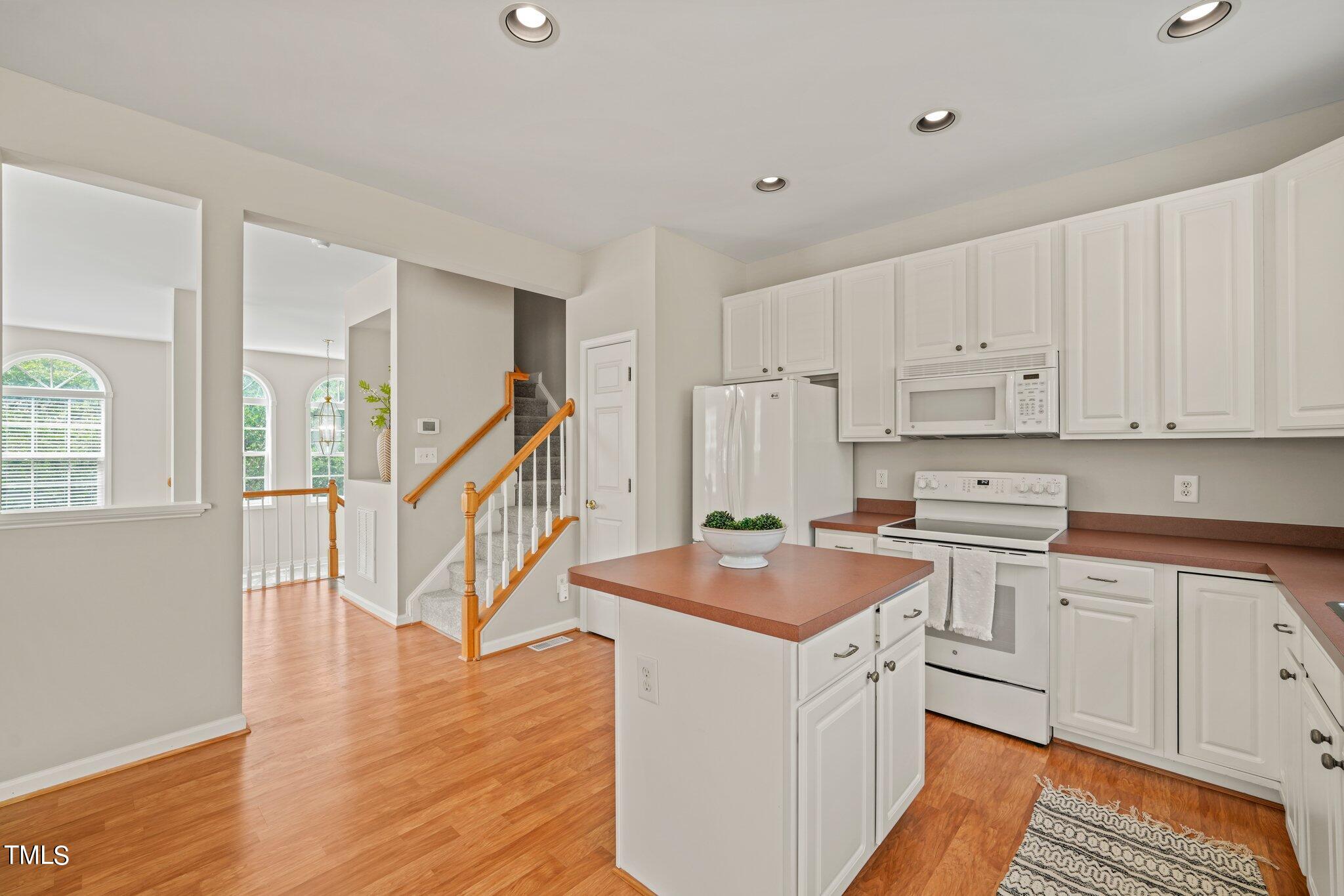 5325 Echo Ridge Road Raleigh, NC 27612 - Photo 14 of 61 a kitchen that has a sink and a stove in it