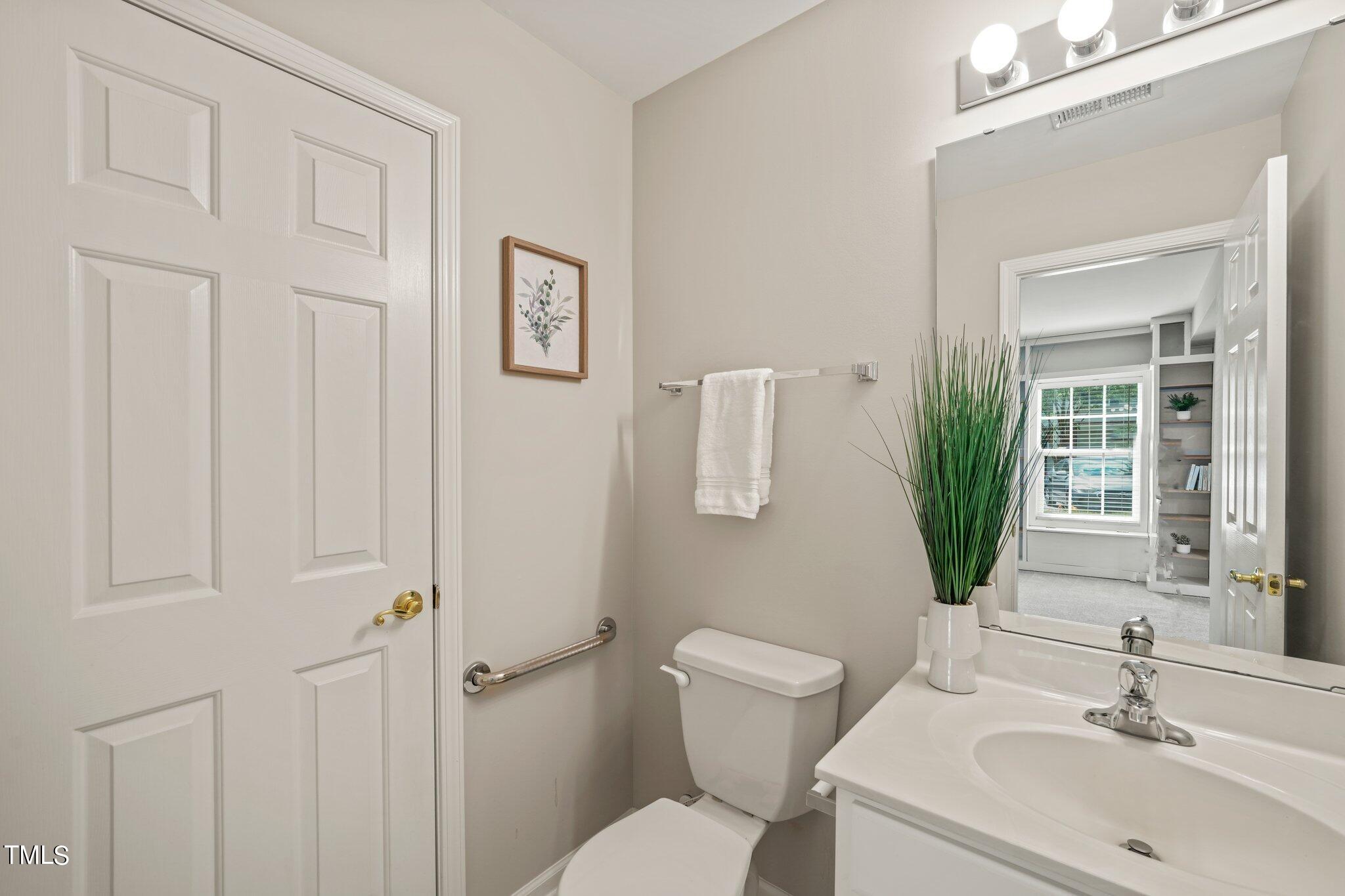 5325 Echo Ridge Road Raleigh, NC 27612 - Photo 40 of 61 a bathroom with a toilet sink and tub