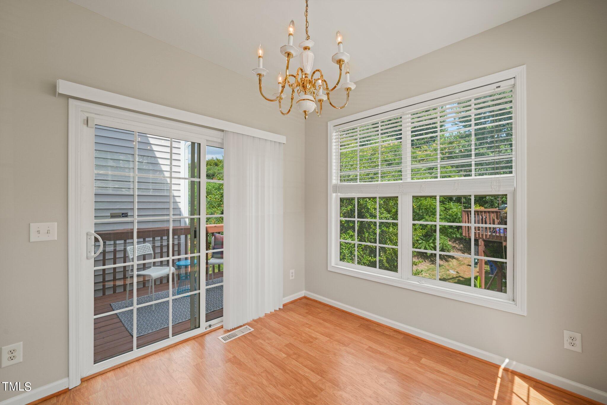 5325 Echo Ridge Road Raleigh, NC 27612 - Photo 7 of 61 a view of an empty room with a window