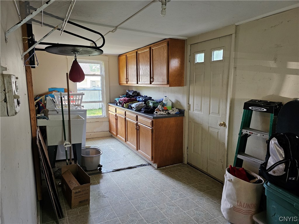 605 Buckley Road Salina, NY 13088 - Photo 24 of 33 1st floor laundry and rear mudroom with backyard a