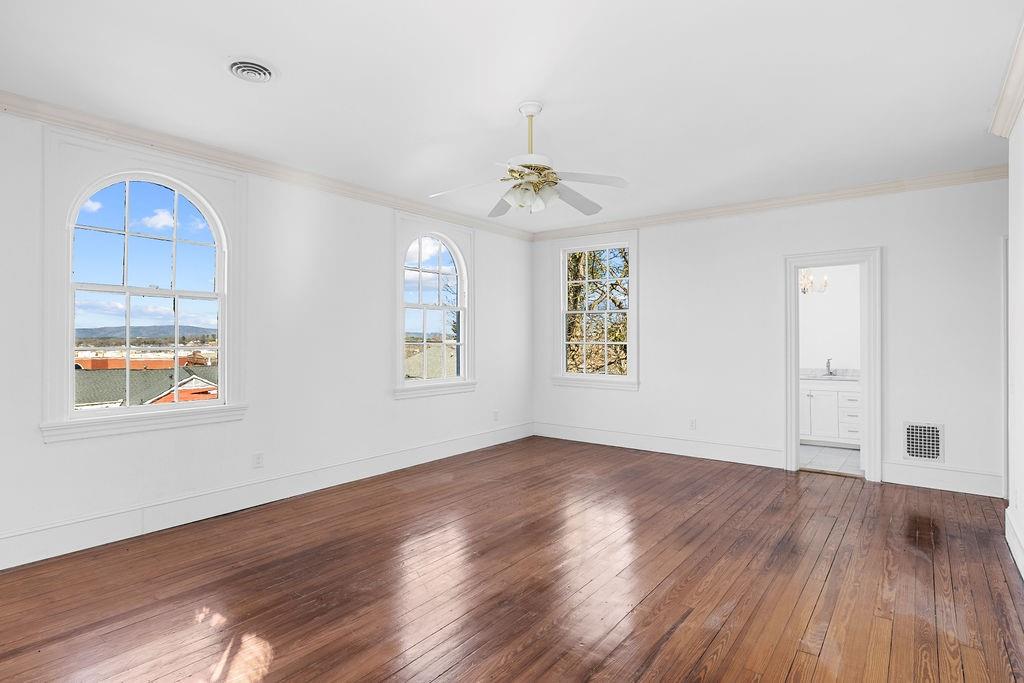 312 East 3rd Street Rome, GA 30161 - Photo 35 of 42 wooden floor in an empty room with a window