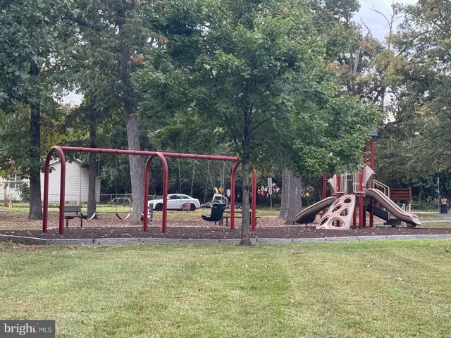 a view of a park with swings